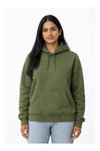 Woman wearing an olive green hoodie on a white background