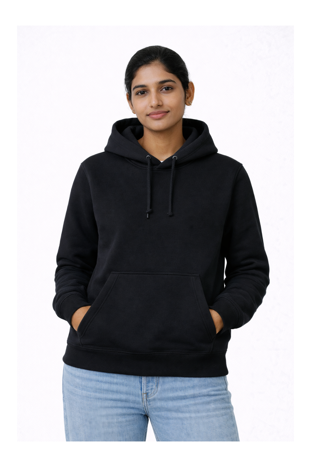 Person wearing a black hoodie and light blue jeans on a white background