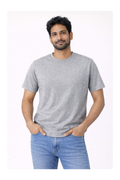 Man wearing a gray t-shirt and blue jeans on a white background