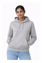 Woman wearing a gray hoodie on a white background
