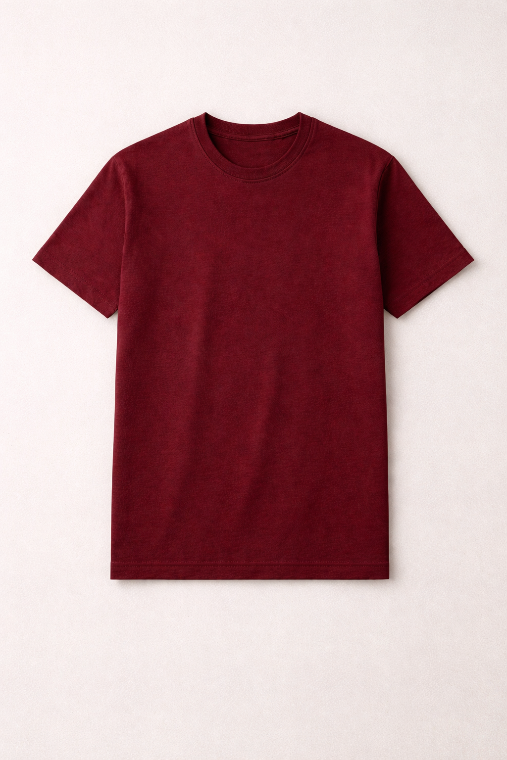 Maroon t-shirt on a light beige background