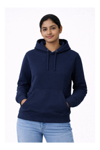 Person wearing a navy blue hoodie on a white background