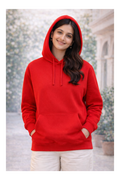 Person wearing a red hoodie with a blurred background