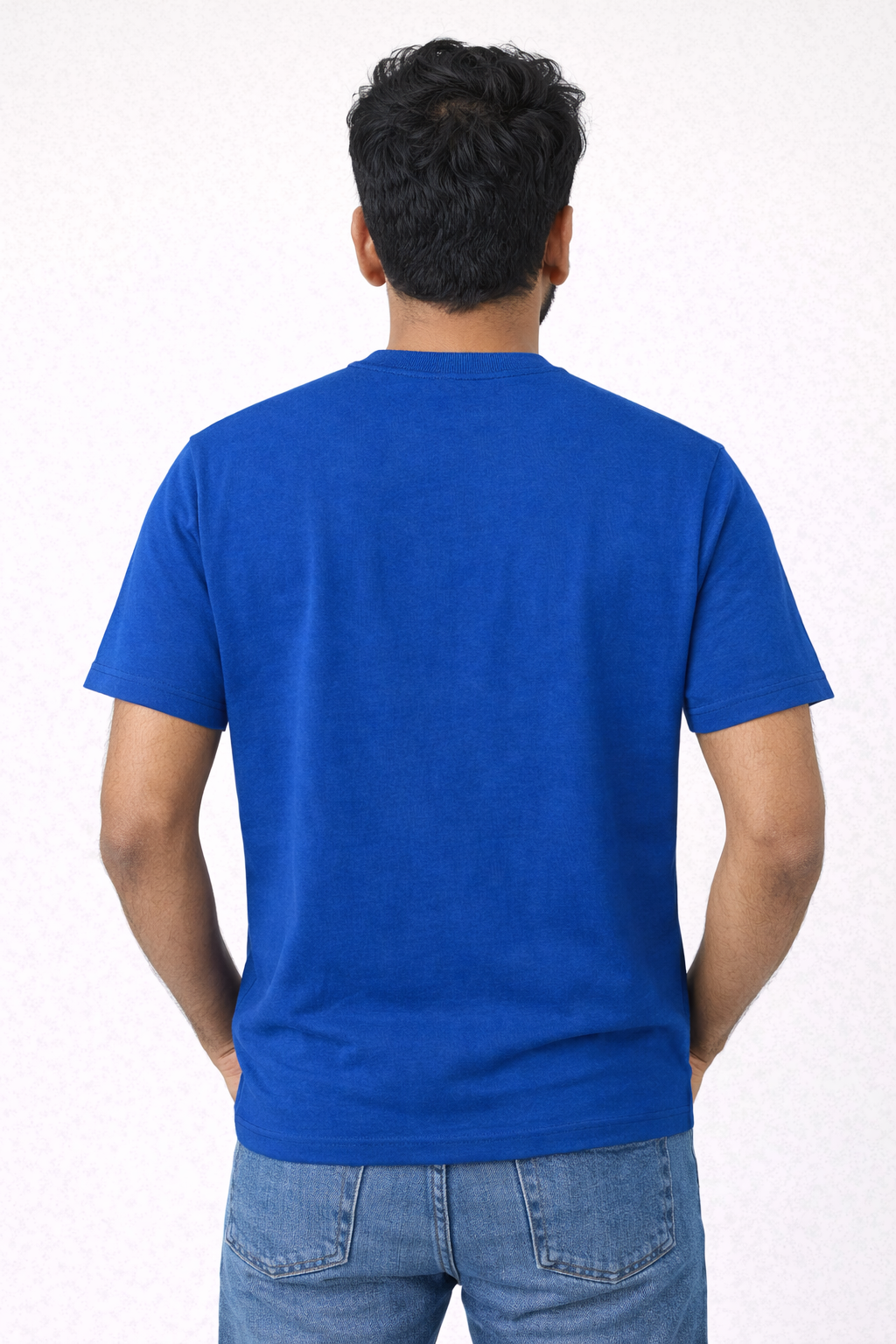 Person wearing a blue t-shirt on a white background