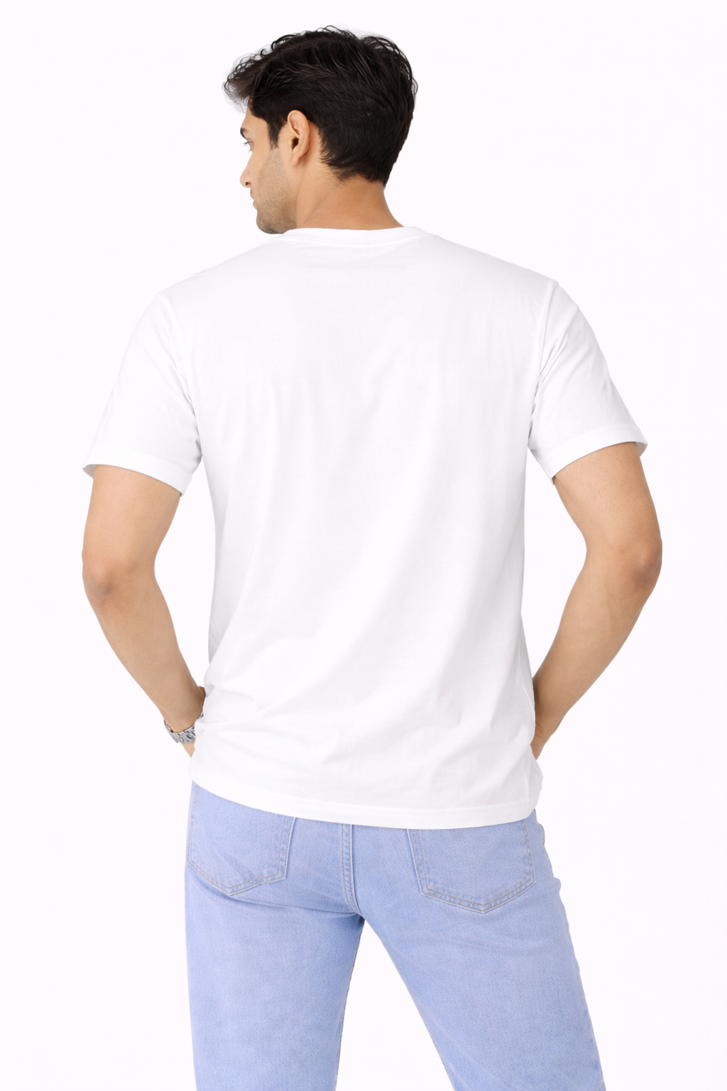 Man wearing a white t-shirt and light blue jeans on a white background