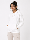 A woman wearing a white pullover hoodie with drawstrings and a front kangaroo pocket, paired with light beige cargo pants, against a plain white studio background.