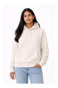 Woman wearing a white hoodie and light blue jeans on a white background